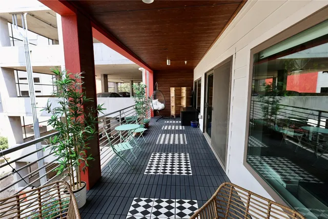 a view of a room with wooden floor