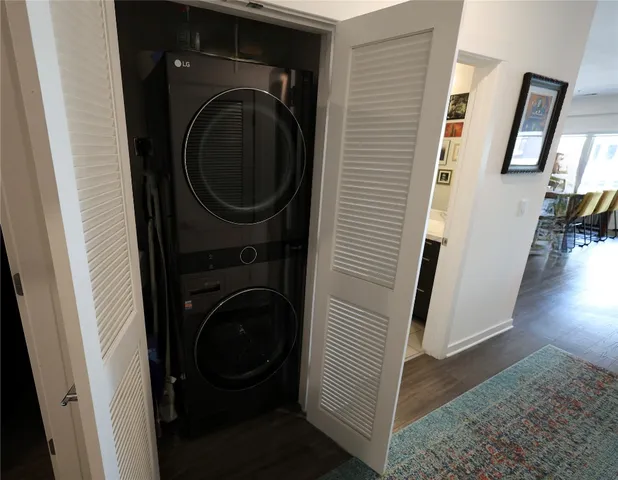 a view of a hallway with washer and dryer