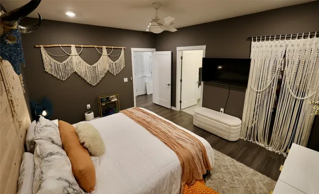 a bedroom with a bed and a mirror