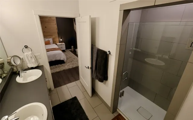 a bathroom with a sink toilet and shower
