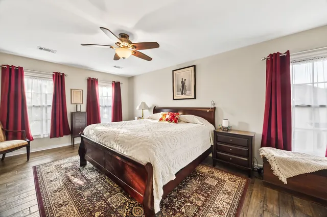 a bed room with a bed and a window