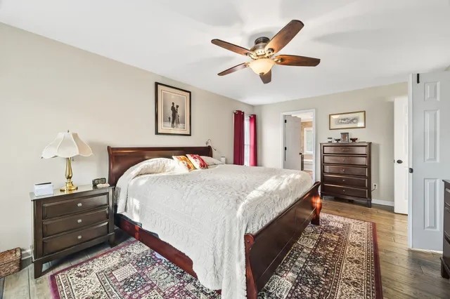 a bed room with a bed and a chandelier