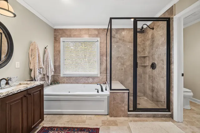 a bathroom with a bathtub and a shower