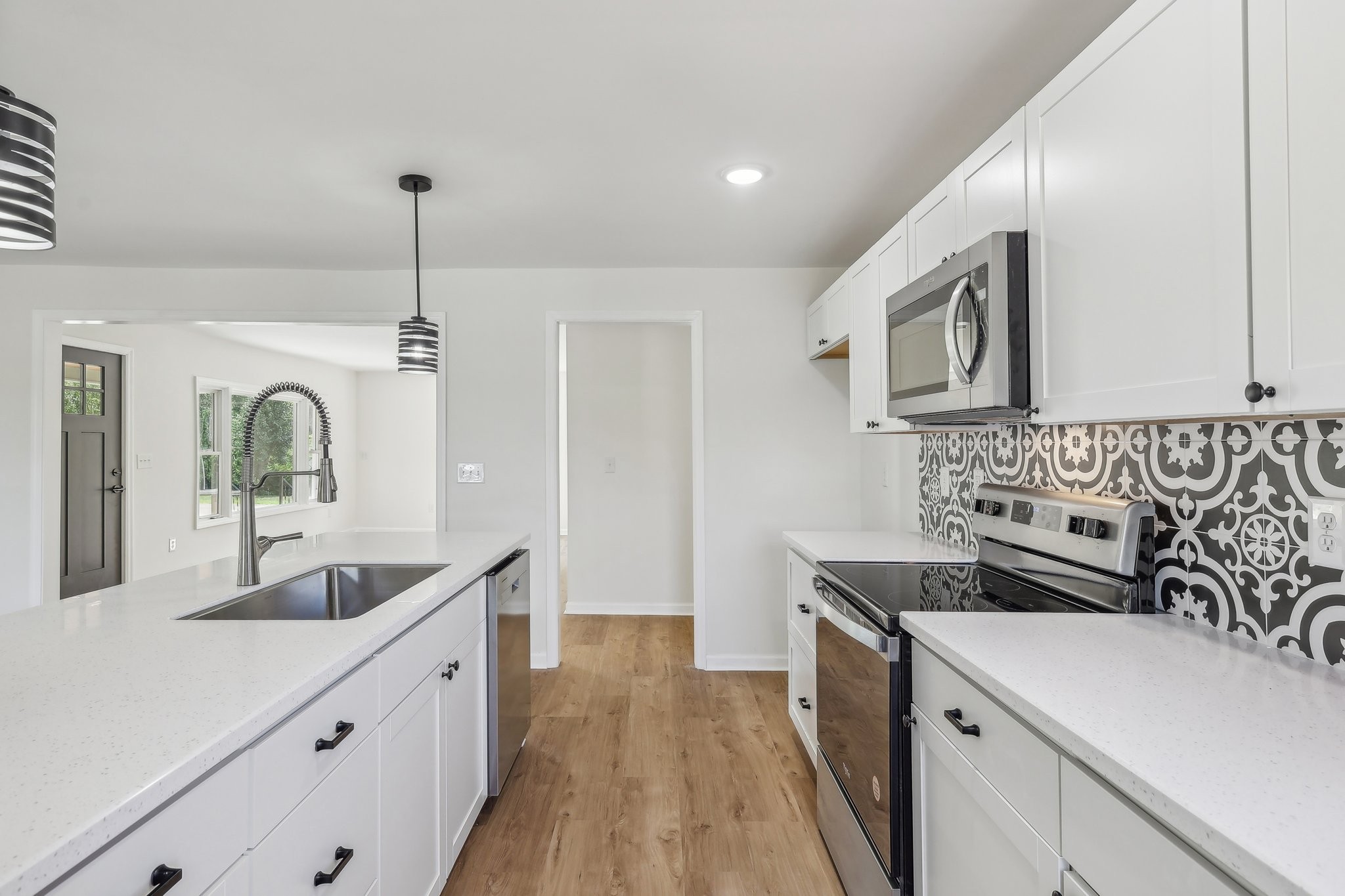 876 Ford Road White Bluff, TN 37187 - Photo 13 of 56 a kitchen with granite countertop a sink stainless steel appliances and cabinets