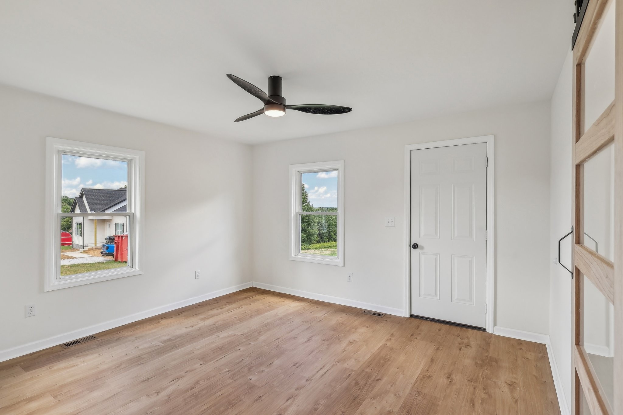 876 Ford Road White Bluff, TN 37187 - Photo 15 of 56 a view of empty room with wooden floor and window