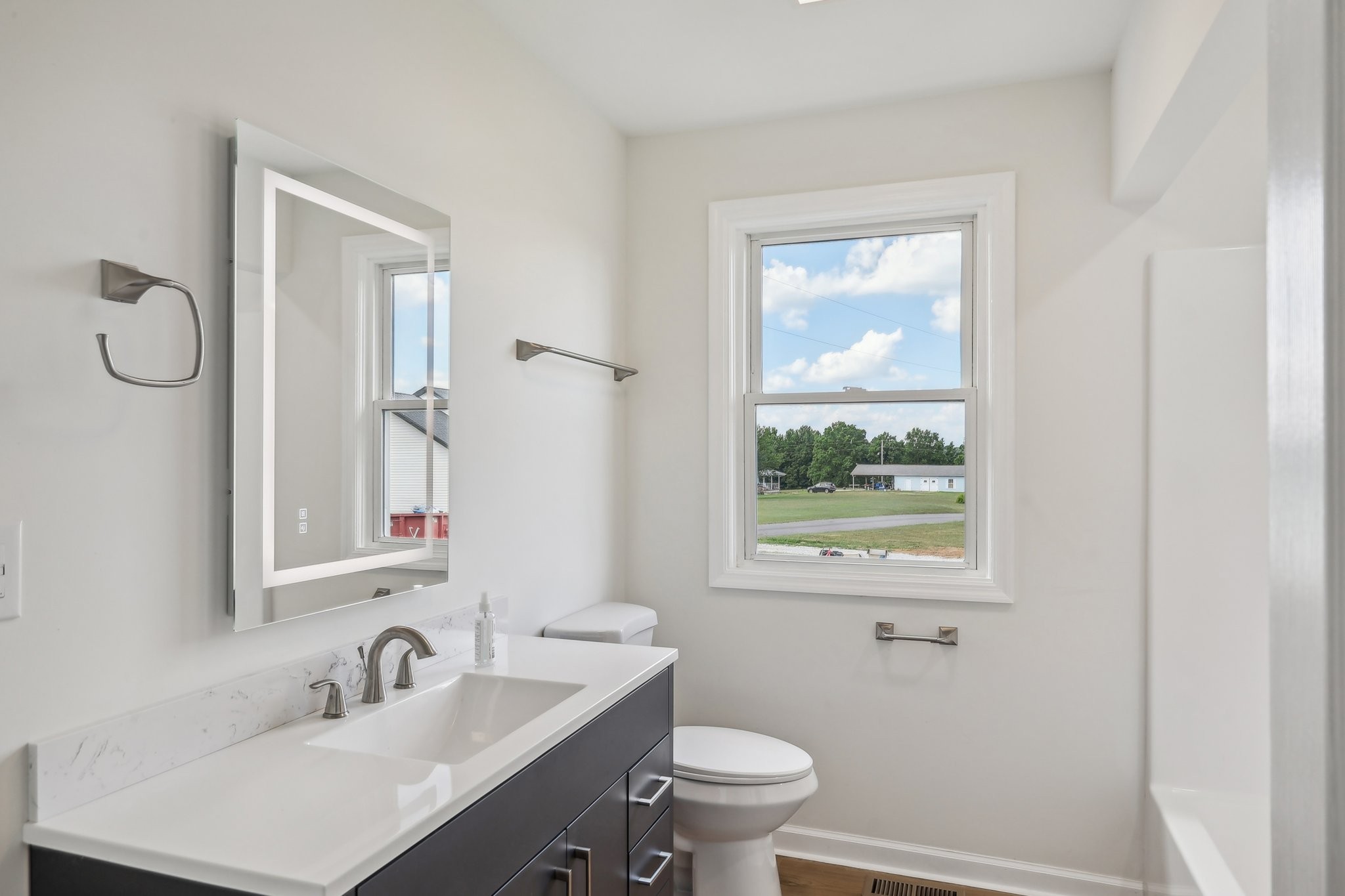 876 Ford Road White Bluff, TN 37187 - Photo 27 of 56 a bathroom with a sink toilet and window