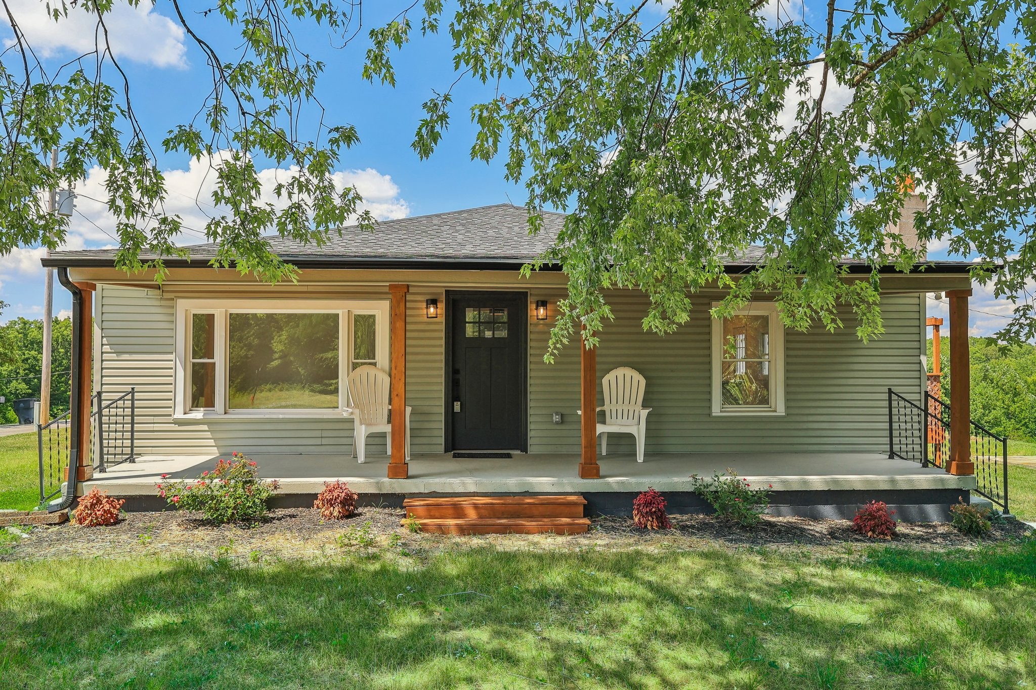 876 Ford Road White Bluff, TN 37187 - Photo 28 of 56 a front view of a house with a garden