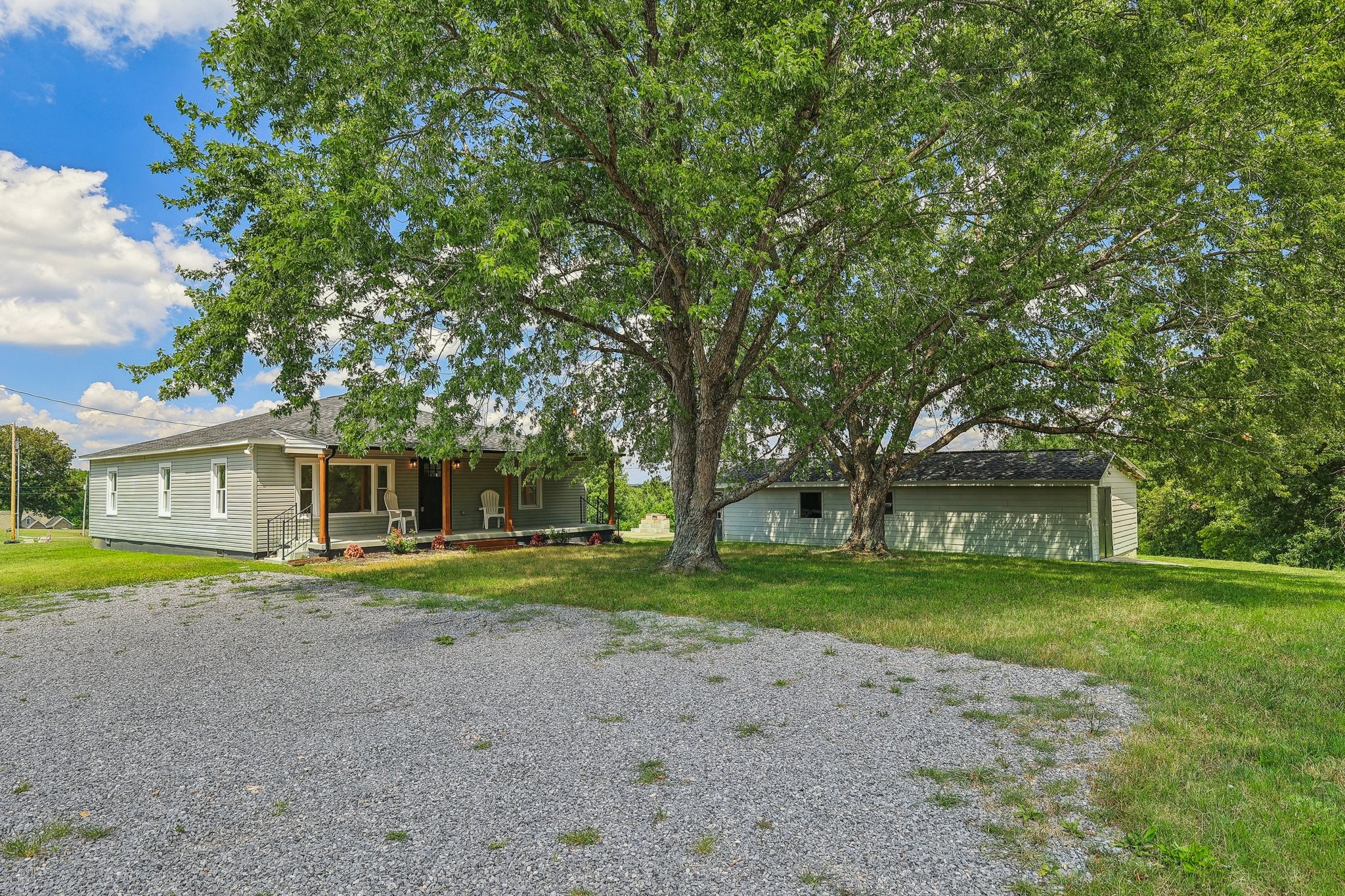 876 Ford Road White Bluff, TN 37187 - Photo 31 of 56 a front view of a house with a yard and trees