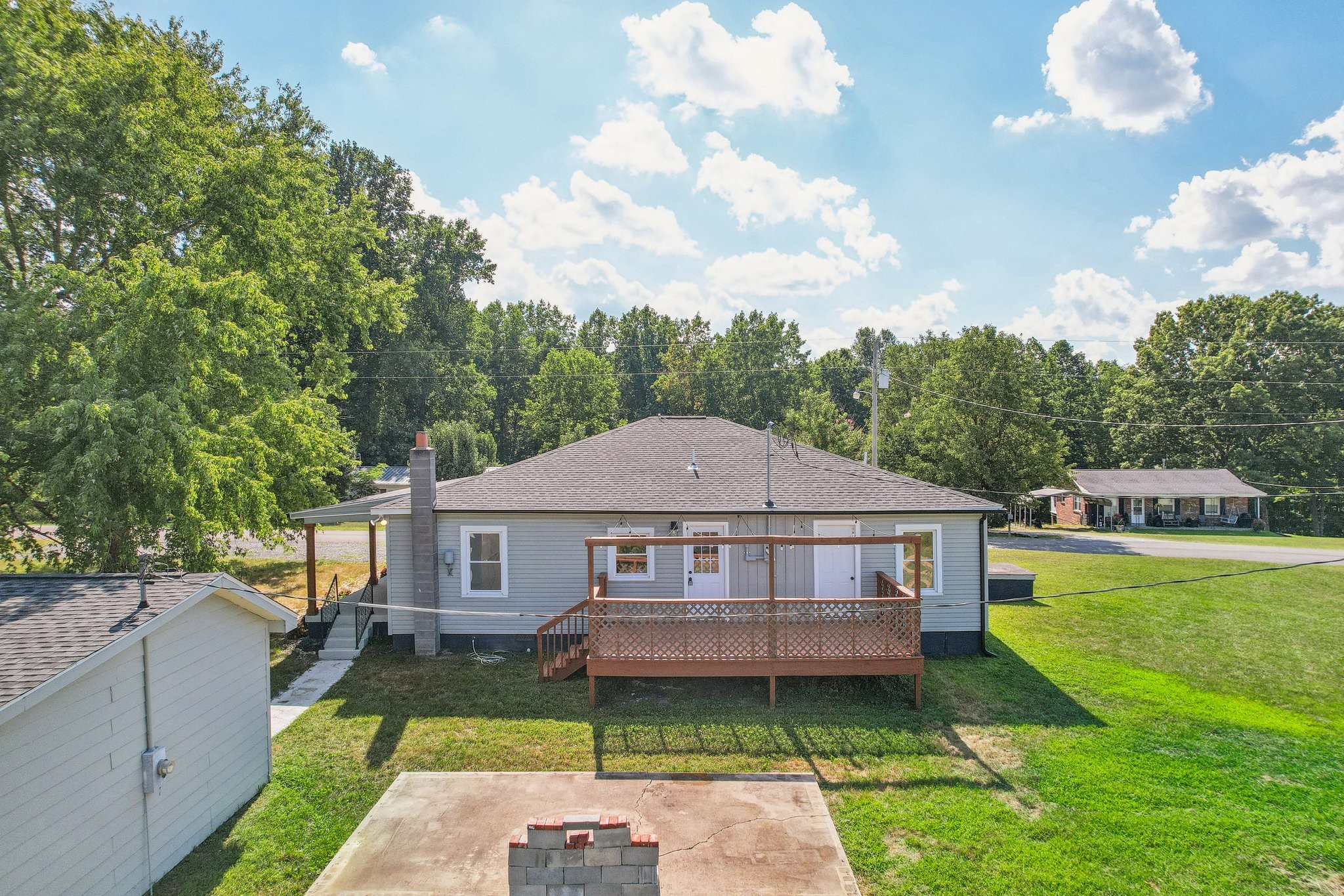 876 Ford Road White Bluff, TN 37187 - Photo 35 of 56 a aerial view of a house next to a yard with plants and large trees