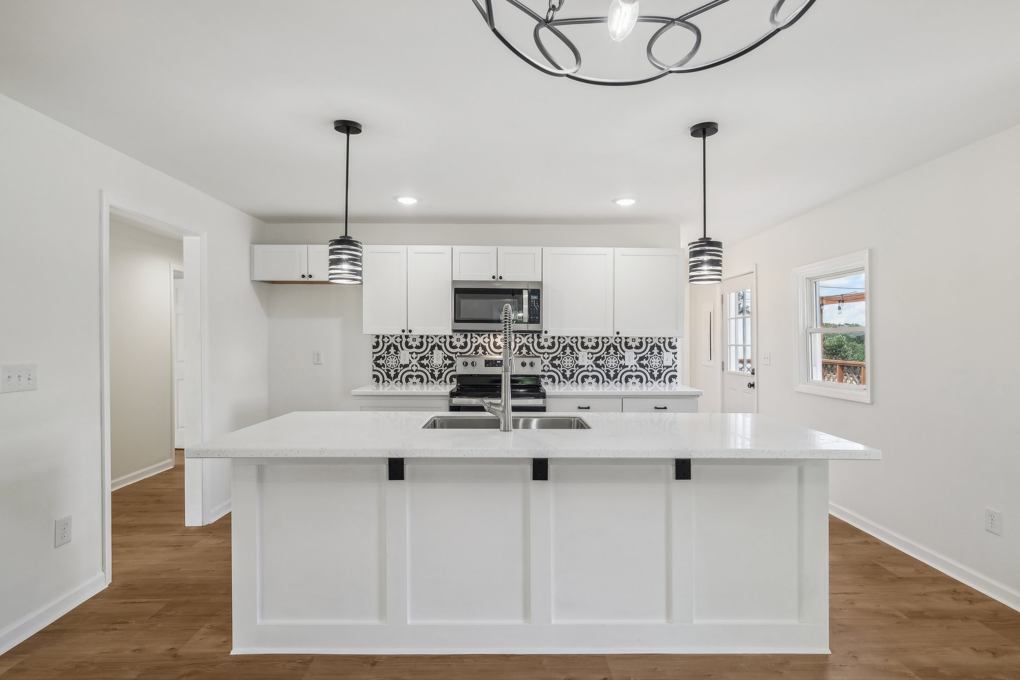 876 Ford Road White Bluff, TN 37187 - Photo 10 of 56 a kitchen with kitchen island white cabinets and refrigerator
