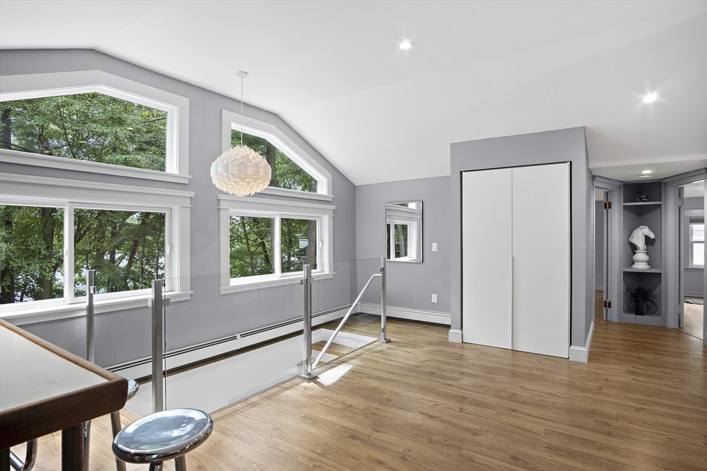 80 Evergreen Road Natick, MA 01760 - Photo 11 of 39 a living room with a large window and furniture