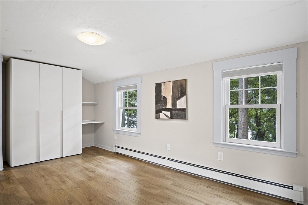 80 Evergreen Road Natick, MA 01760 - Photo 12 of 39 an empty room with windows and closet