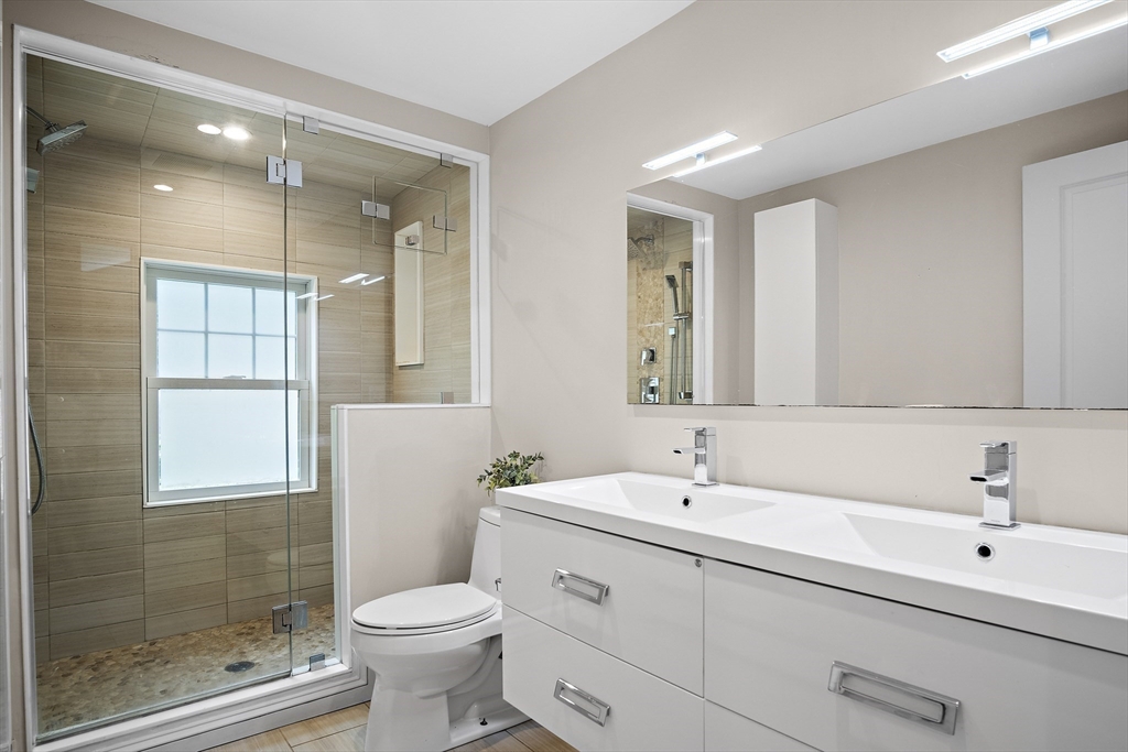 80 Evergreen Road Natick, MA 01760 - Photo 16 of 39 a bathroom with a sink toilet and shower