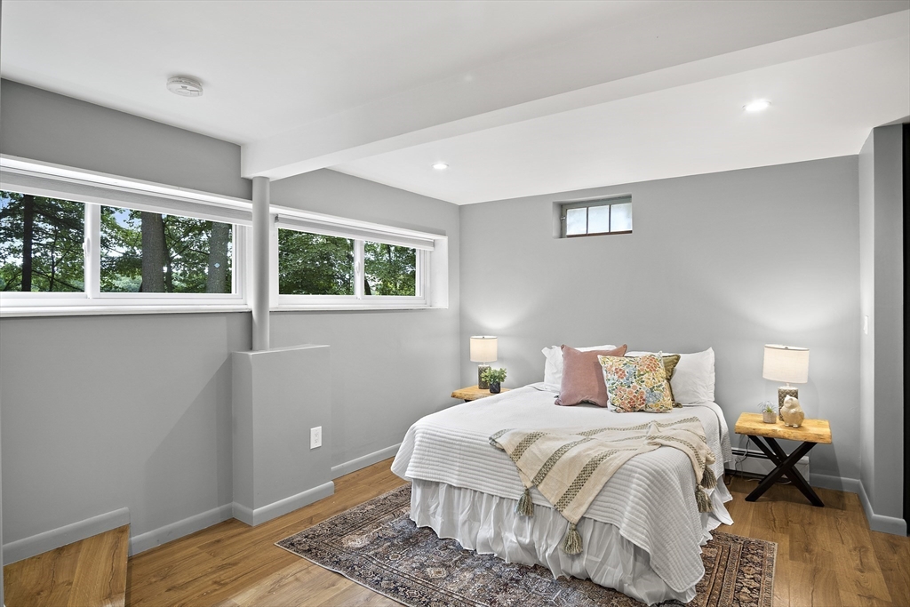 80 Evergreen Road Natick, MA 01760 - Photo 18 of 39 a bedroom with a bed and wooden floor