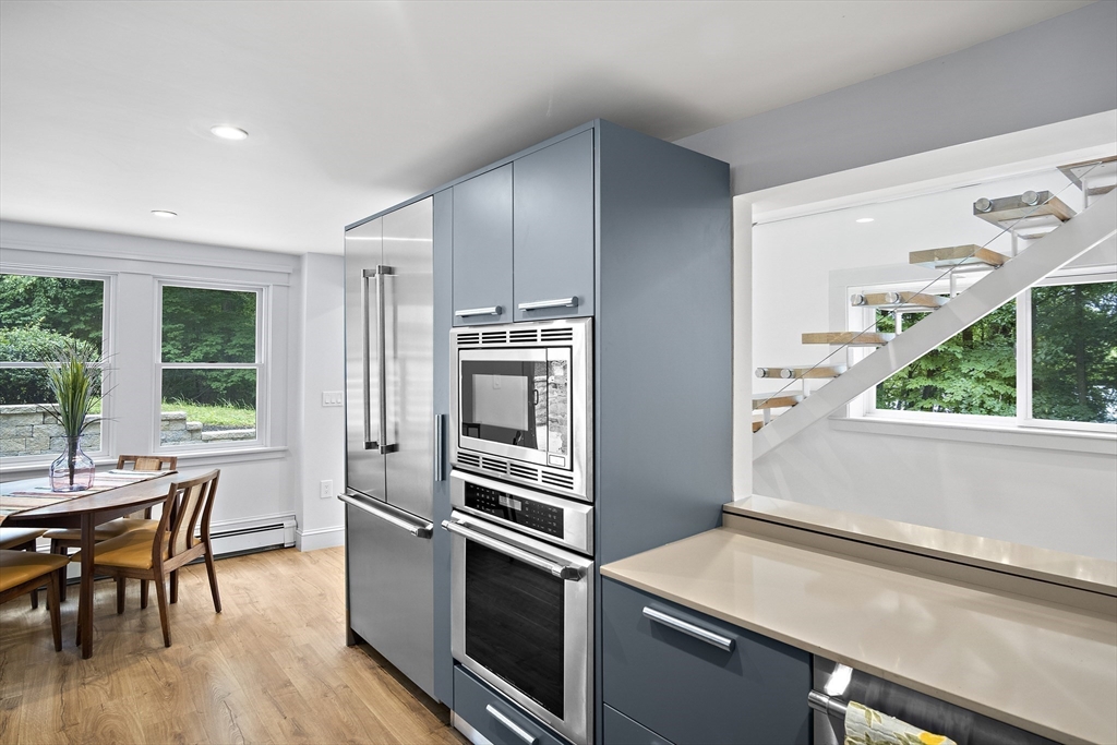 80 Evergreen Road Natick, MA 01760 - Photo 23 of 39 a kitchen with a stove a sink and a refrigerator