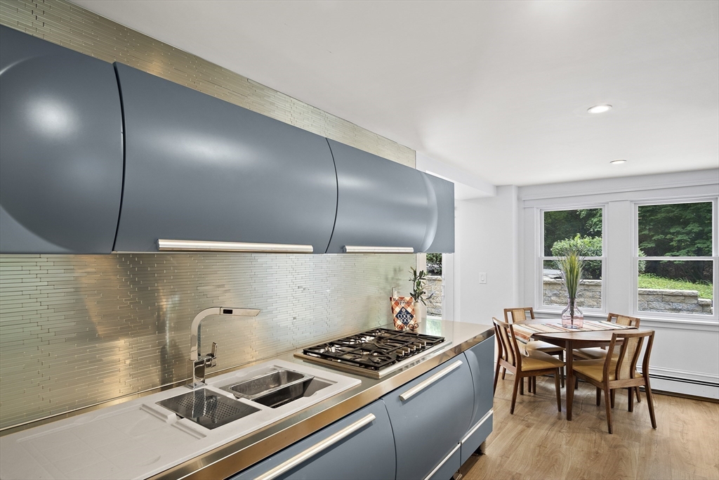 80 Evergreen Road Natick, MA 01760 - Photo 24 of 39 a kitchen with a stove and a table