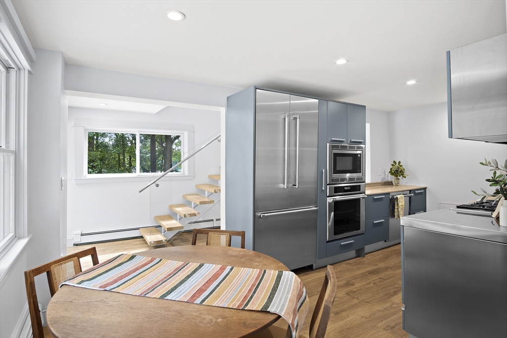 80 Evergreen Road Natick, MA 01760 - Photo 25 of 39 a kitchen with stainless steel appliances granite countertop a refrigerator sink and stove