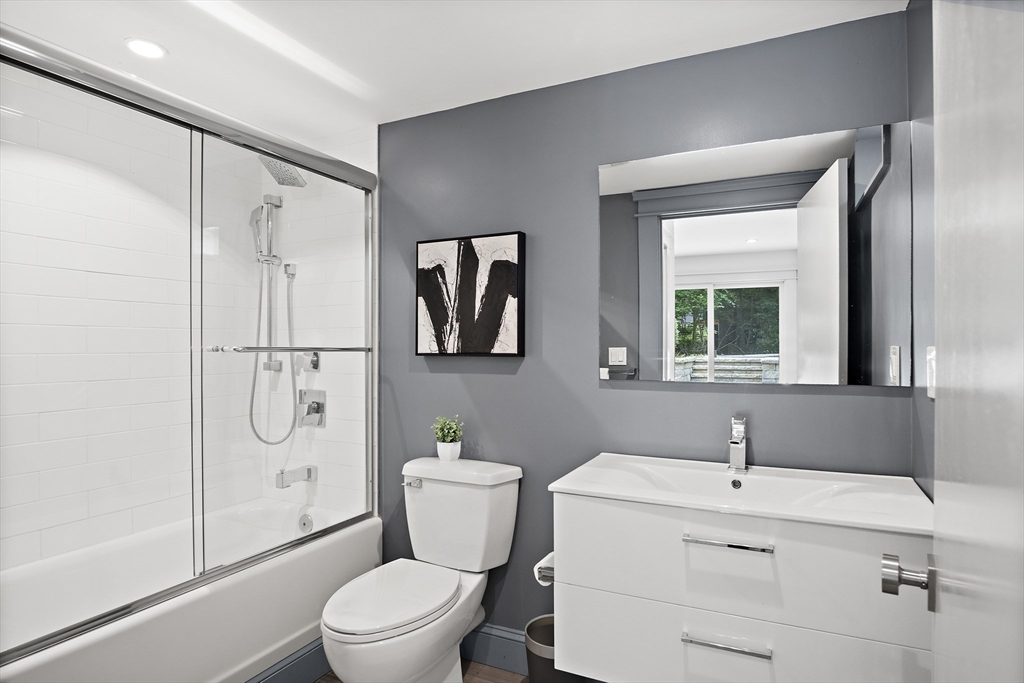 80 Evergreen Road Natick, MA 01760 - Photo 26 of 39 a bathroom with a granite countertop toilet sink and shower