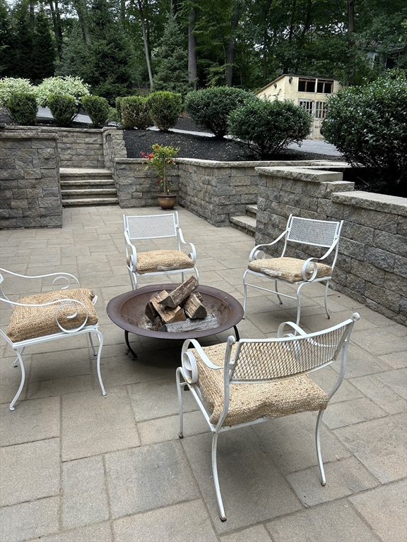80 Evergreen Road Natick, MA 01760 - Photo 30 of 39 a view of a patio with chairs and tables