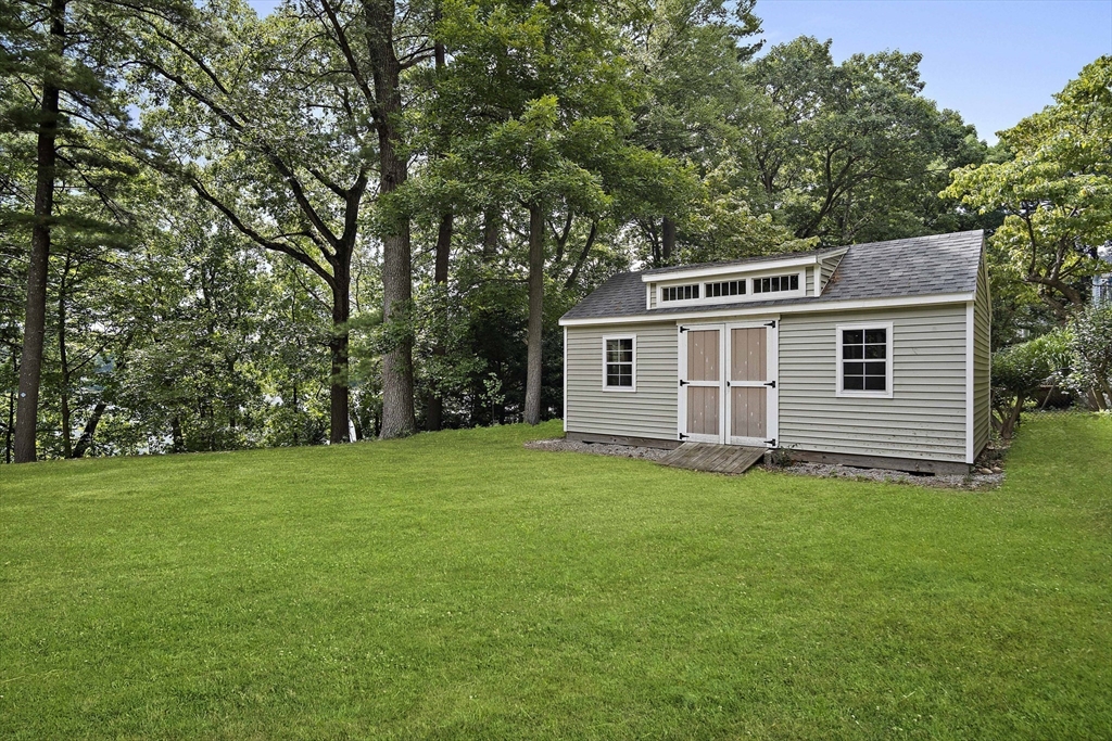 80 Evergreen Road Natick, MA 01760 - Photo 37 of 39 a backyard of a house with lots of green space