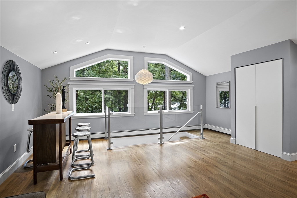 80 Evergreen Road Natick, MA 01760 - Photo 10 of 39 a view of an empty room with a window and wooden floor