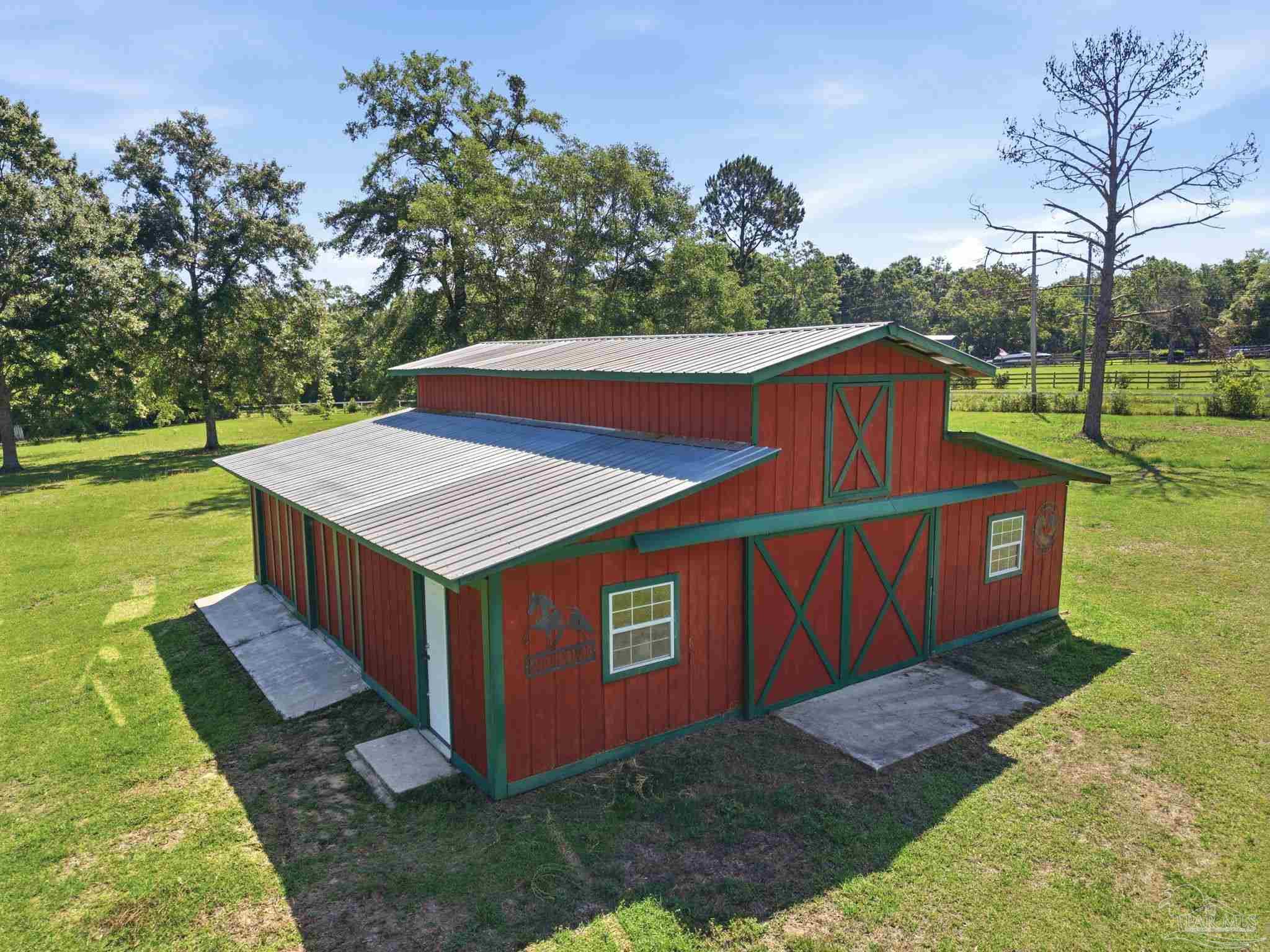 6870 Martin Road Milton, FL 32570 - Photo 38 of 48 a view of an house with backyard space and balcony