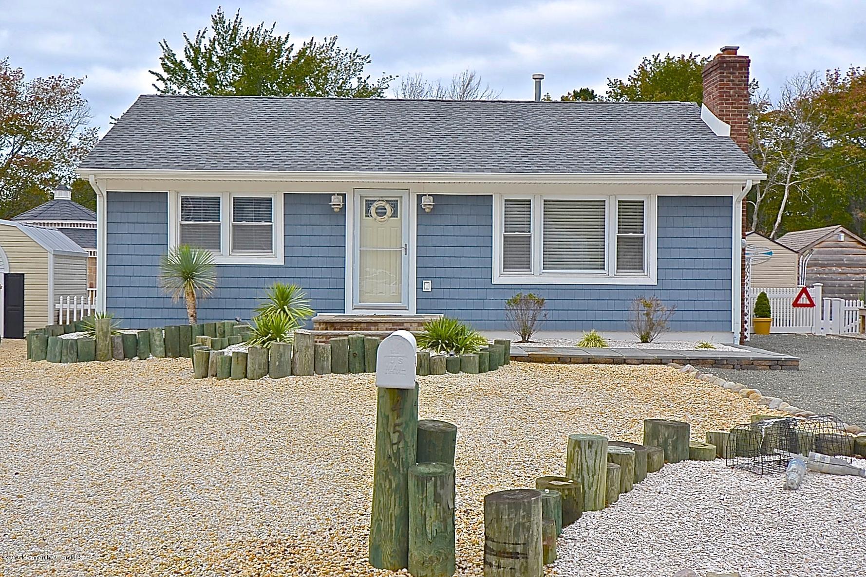 45 North Island Road Bayville, NJ 08721 - Photo 1 of 31 a front view of a house with garden