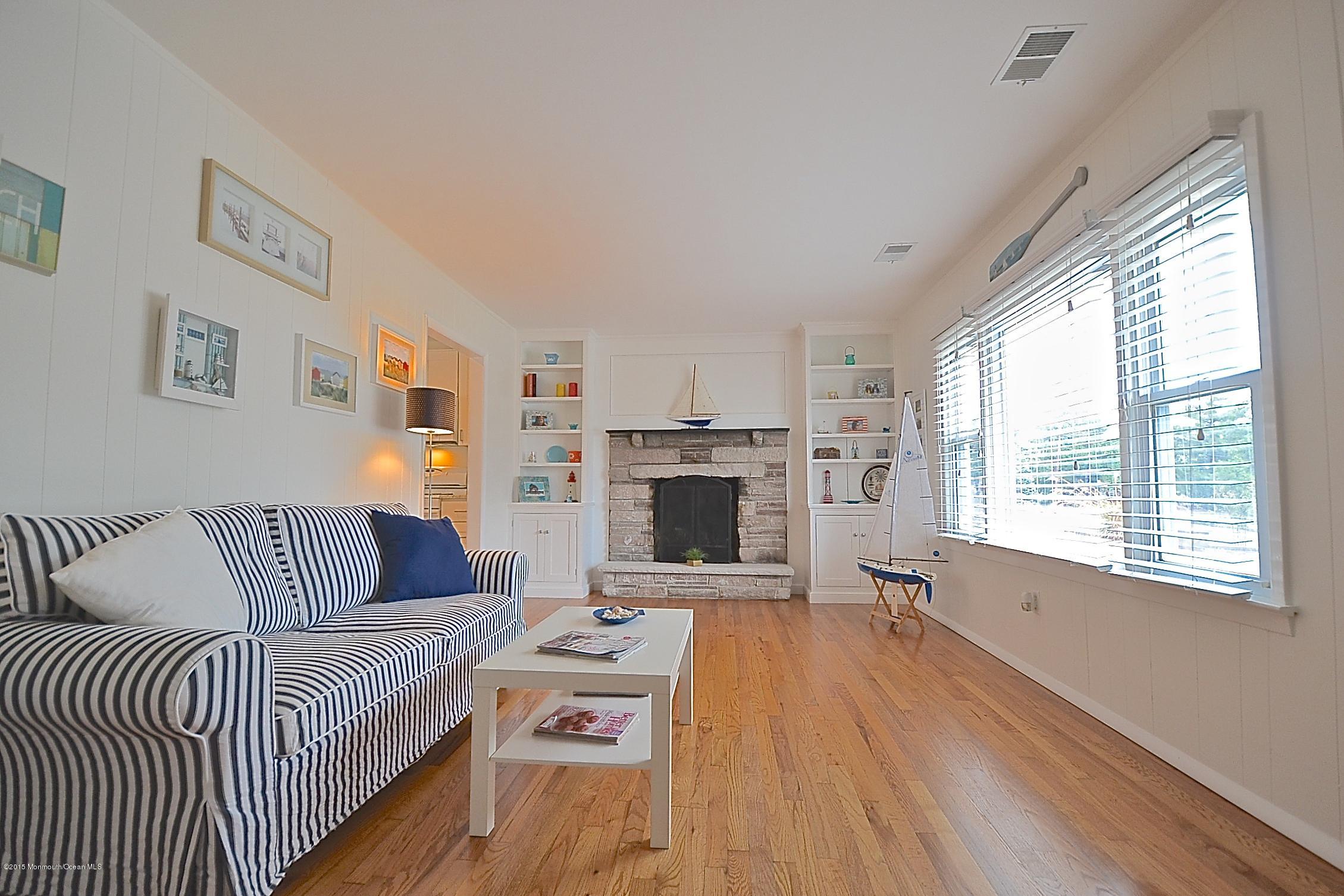 45 North Island Road Bayville, NJ 08721 - Photo 13 of 31 a living room with furniture fireplace and window
