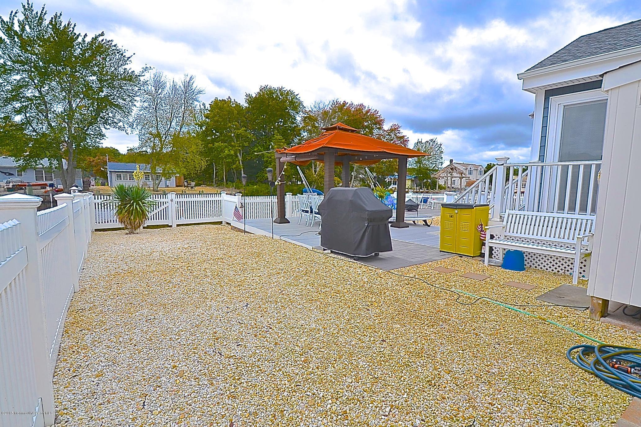 45 North Island Road Bayville, NJ 08721 - Photo 27 of 31 a view of a house with backyard and sitting area