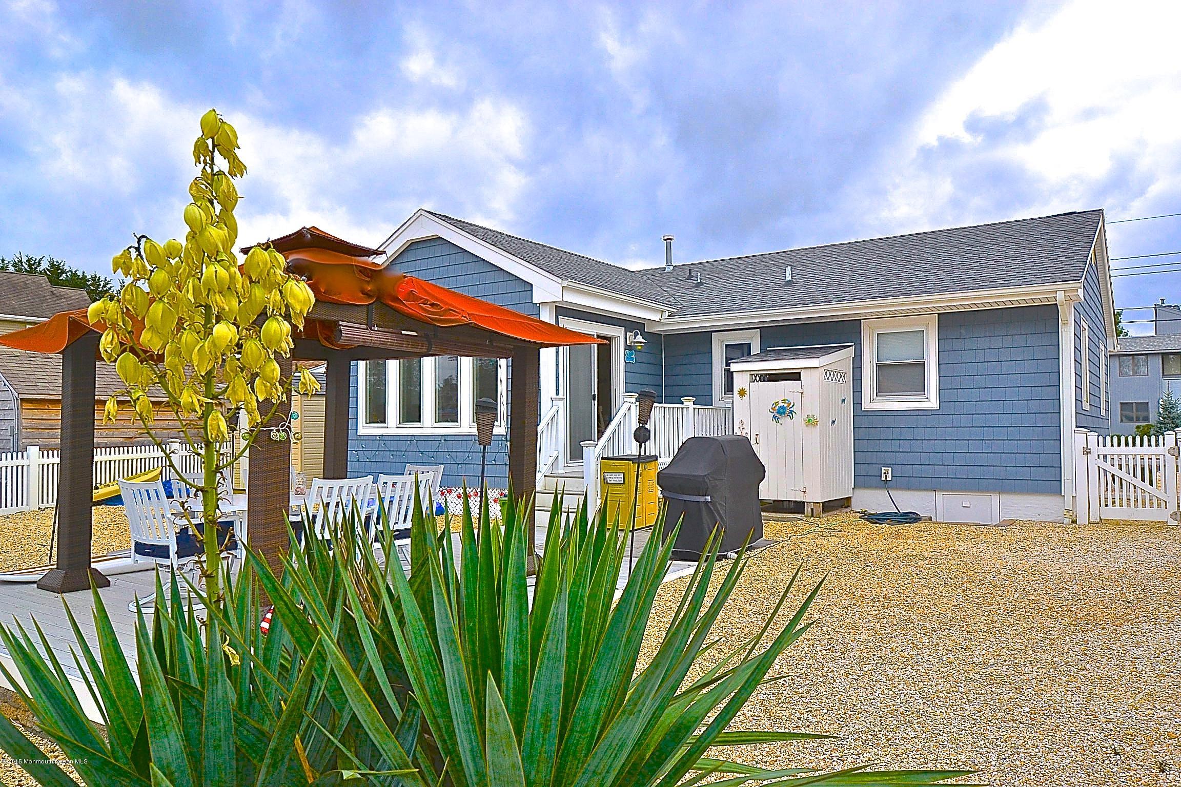 45 North Island Road Bayville, NJ 08721 - Photo 30 of 31 a front view of a house with garden