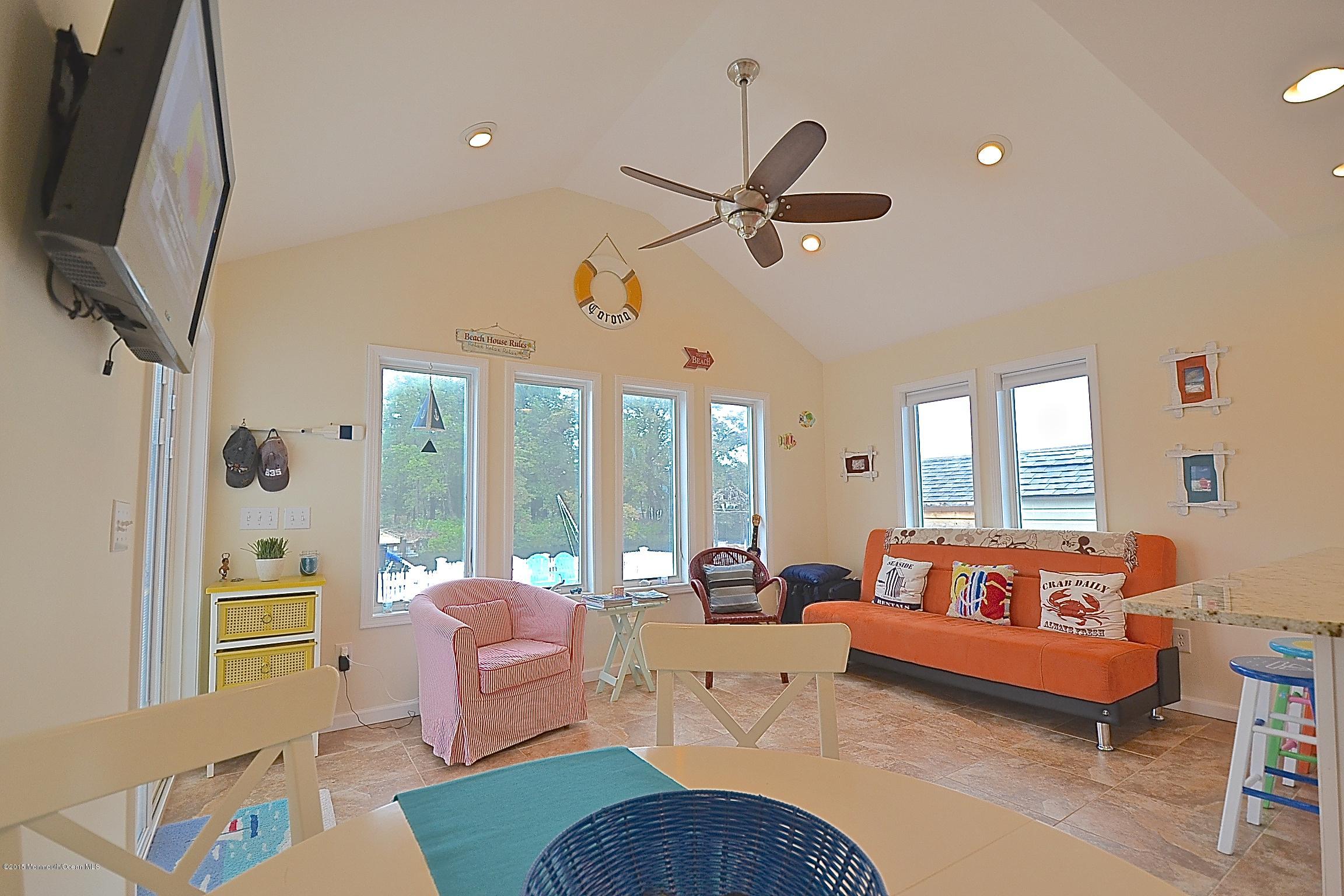 45 North Island Road Bayville, NJ 08721 - Photo 6 of 31 a living room with furniture ceiling fan and a large window