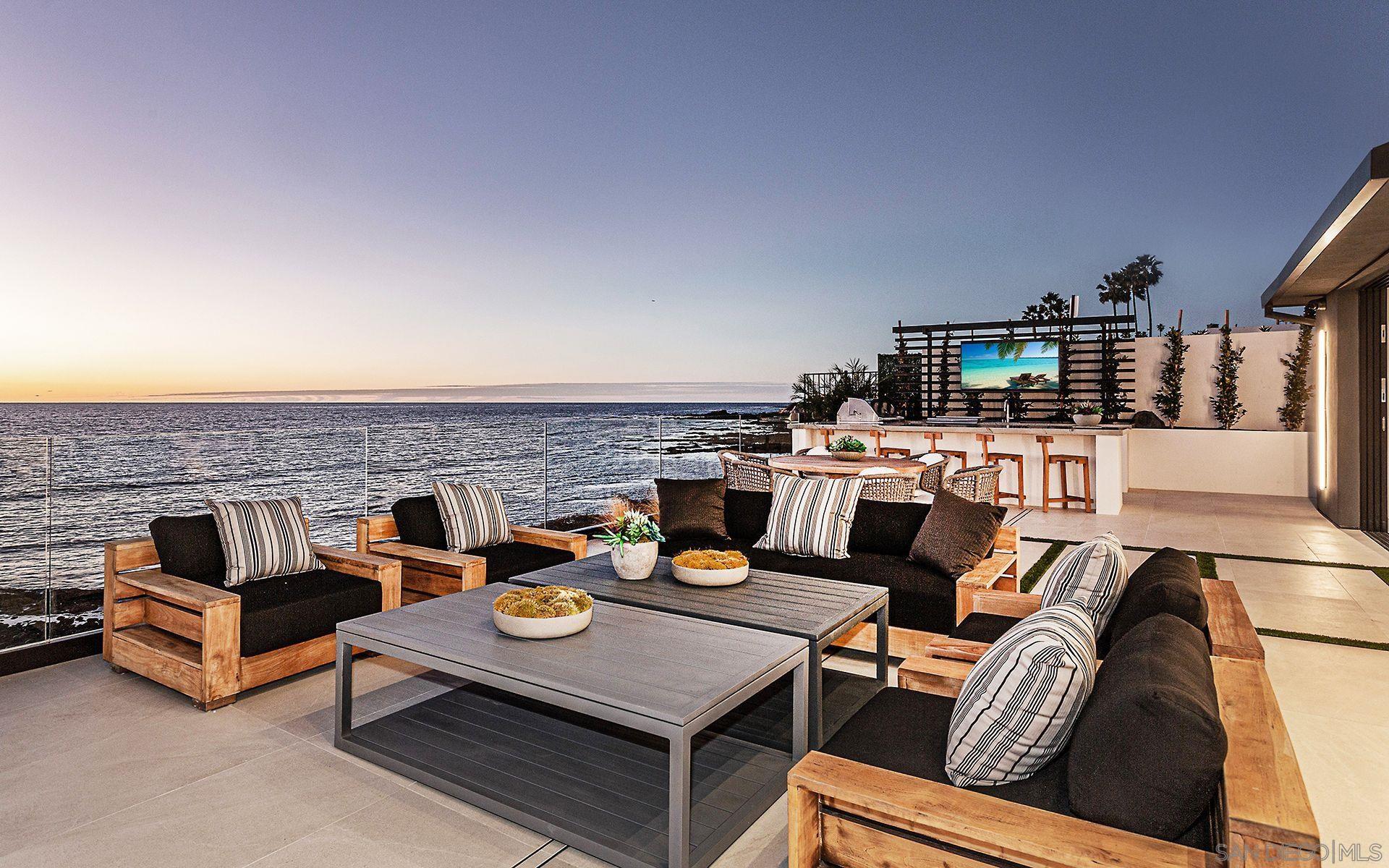 a terrace of a house with outdoor seating