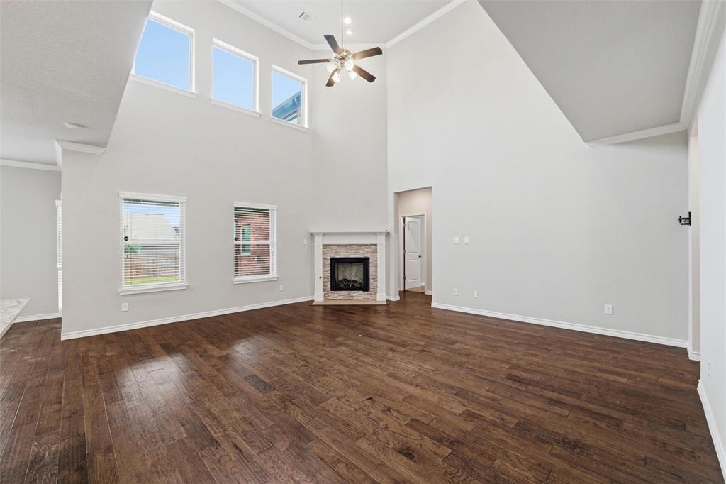 420 Prairie Run Aledo, TX 76008 - Photo 7 of 38 a view of an empty room with wooden floor and a window