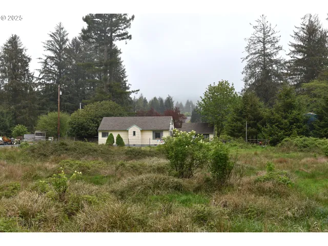 a aerial view of a house with a yard