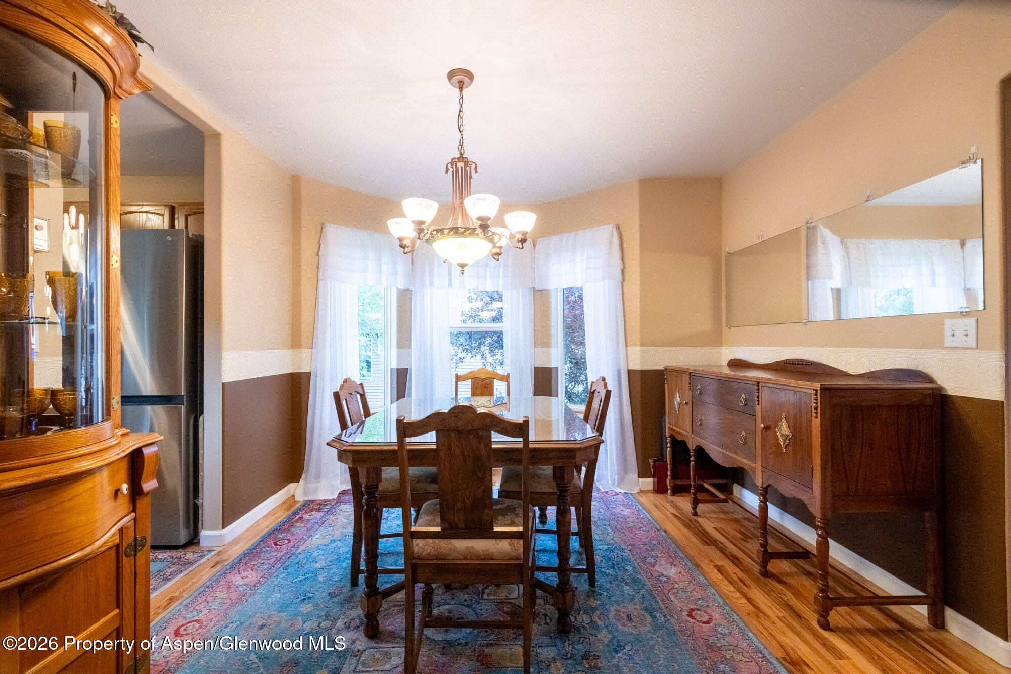 1335 Firethorn Drive Rifle, CO 81650 - Photo 7 of 30 a view of a dining room with furniture window and wooden floor