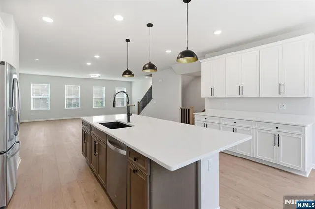 a kitchen that has a lot of cabinets in it