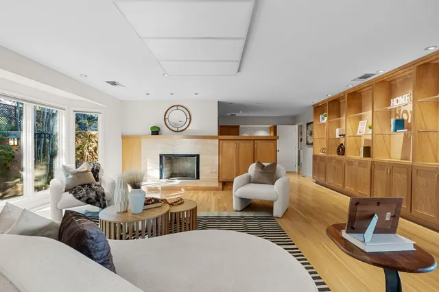 a kitchen with a sink a counter top space and stainless steel appliances