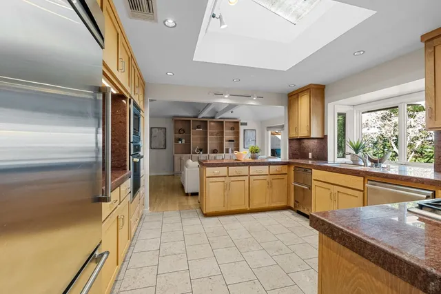 a utility room with cabinets washer and dryer