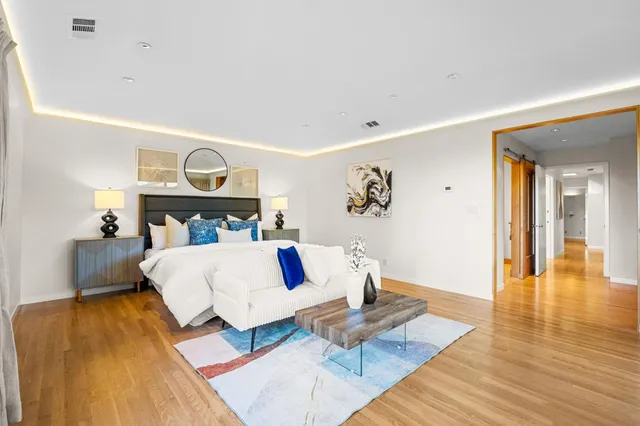 a view of a house with swimming pool and sitting area