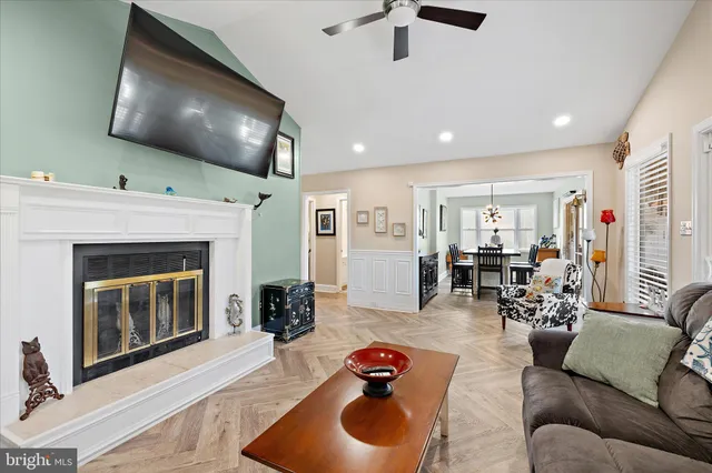 a living room with furniture and a fireplace