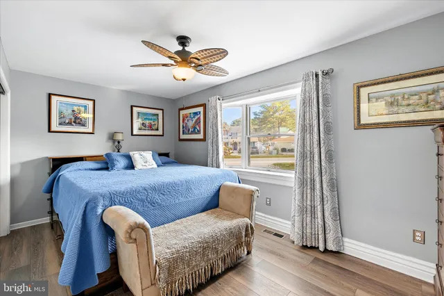 a bed room with furniture and a window