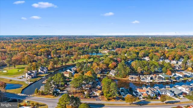 an aerial view of residential building and ocean