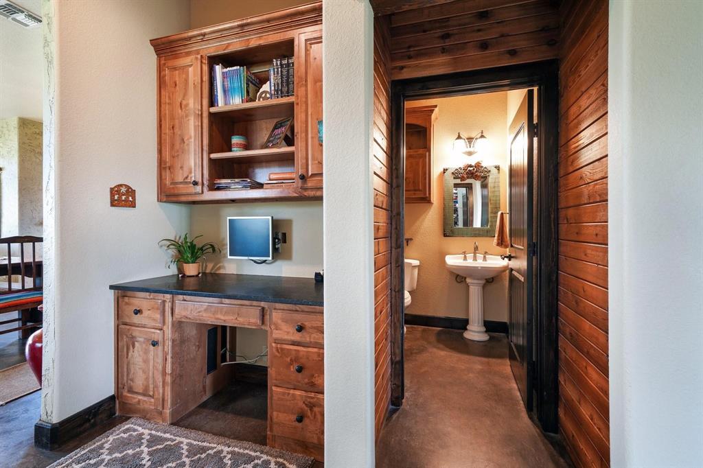 1084 Beddo Mountain Road Santo, TX 76472 - Photo 13 of 40 a view of a bathroom from a hallway