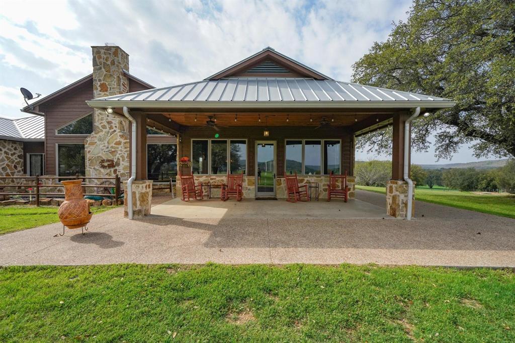 1084 Beddo Mountain Road Santo, TX 76472 - Photo 18 of 40 a view of a house with sitting area and garden