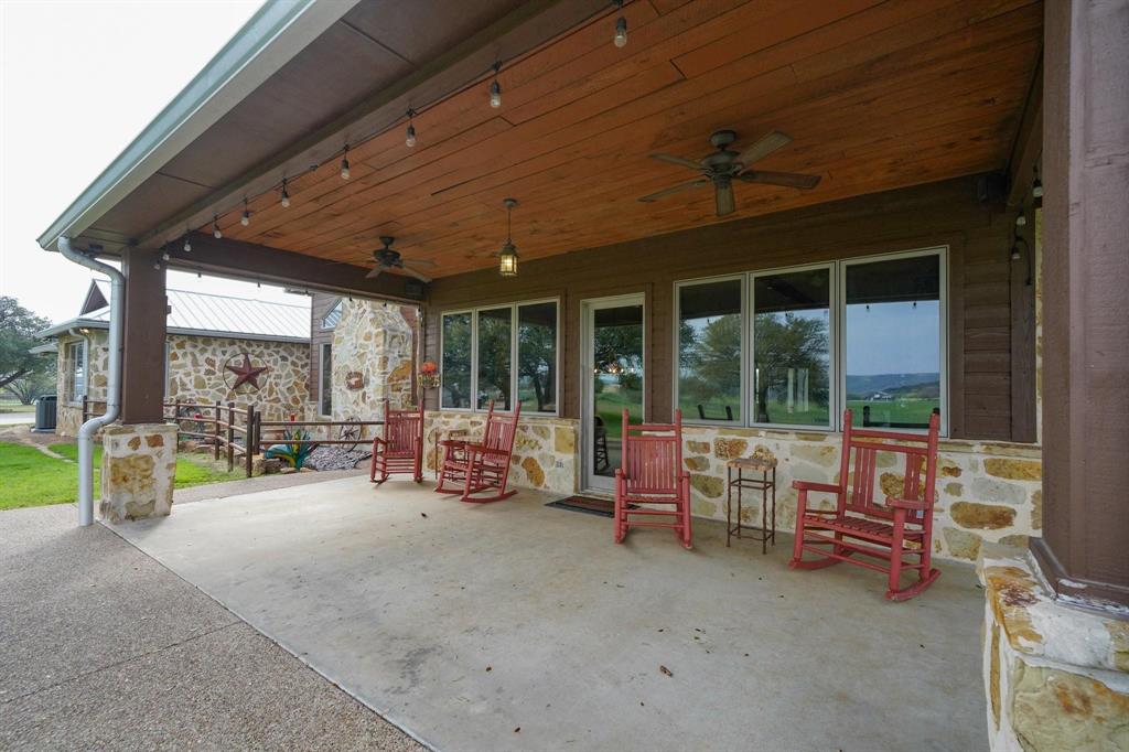 1084 Beddo Mountain Road Santo, TX 76472 - Photo 19 of 40 a view of a room with furniture and floor to ceiling window