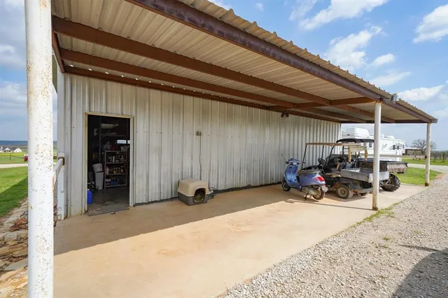 a view of a storage room with furniture and white walls
