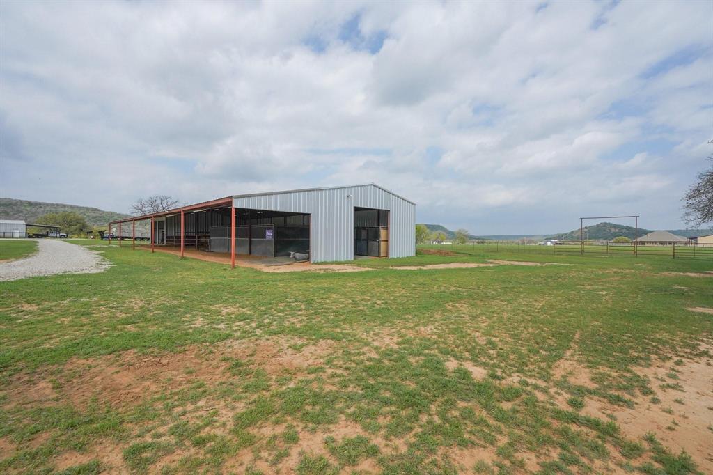 1084 Beddo Mountain Road Santo, TX 76472 - Photo 29 of 40 a view of a house with a big yard and potted plants