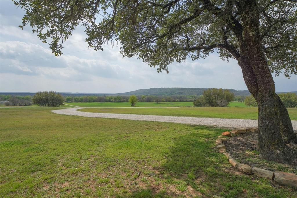 1084 Beddo Mountain Road Santo, TX 76472 - Photo 32 of 40 a view of a lake with a big yard