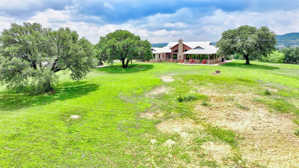 1084 Beddo Mountain Road Santo, TX 76472 - Photo 33 of 40 a view of yard with swimming pool and green space