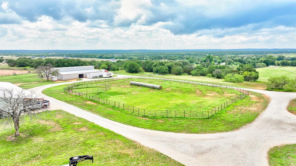 1084 Beddo Mountain Road Santo, TX 76472 - Photo 36 of 40 a view of a swimming pool with a yard